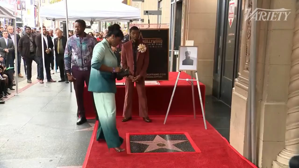 Chadwick Boseman’s wife, Simone Ledward, places his shoes on his new Hollywood Walk of Fame star (November 20, 2025)