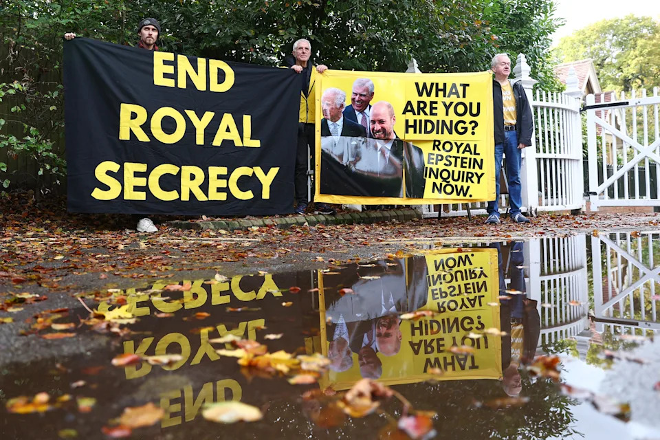 Activists stage a protest at the entrance to Windsor Great Park and Royal Lodge, then the home of Andrew Mountbatten-Windsor, on Oct. 21, 2025.  / Peter Nicholls / Getty Images