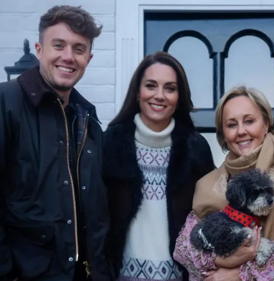 Kate Middleton posing with Martin and Roman Kemp and their family outside their house.