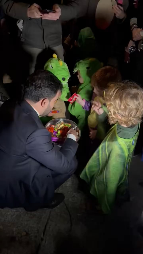 New York City Mayoral candidate Zohran Mamdani gets swarmed as he gives out candy to trick-or-treaters in Park Slope, Brooklyn