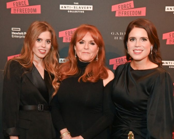 Why Beatrice and Eugenie are still princesses – and what Andrew’s royal demotion means for Sarah Ferguson’s title Beatrice, Sarah and Eugenie in front of a promotional board, all wearing black