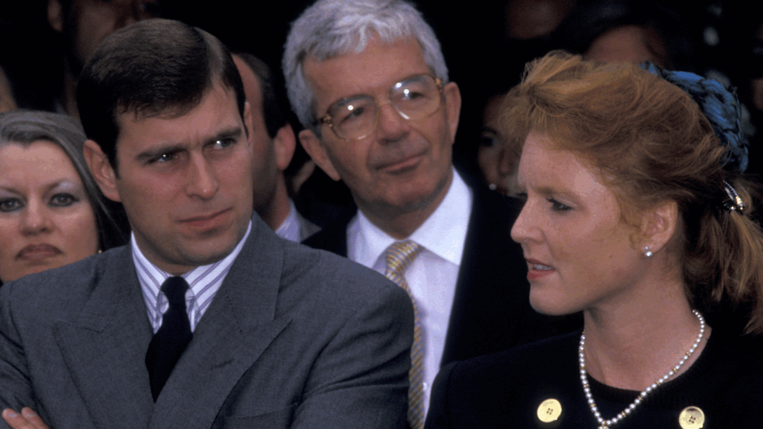 Former Prince Andrew Once “Tried to Push” Singer Meat Loaf “Into a Moat” After Accusing Him of Hitting on Sarah Ferguson Prince Andrew wearing a gray suit, folding his arms and frowning standing next to Sarah Ferguson