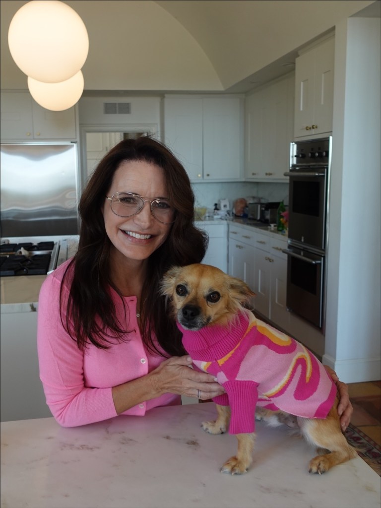 Kristin Davis is pretty in pink while matching with her pup.