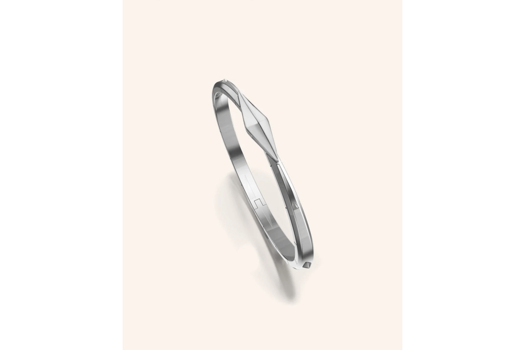 Silver cuff with sharp, geometric details.