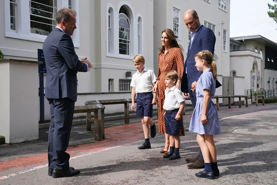 Getty Images Kate Middleton and Prince William at Lambrook School with their kids Prince George, Princess Charlotte, and Prince Louis in 2022