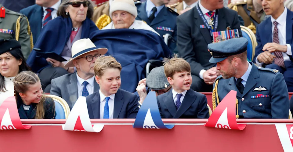 Princess Charlotte, Prince George and Prince Louis talking to Prince William sitting in a row 