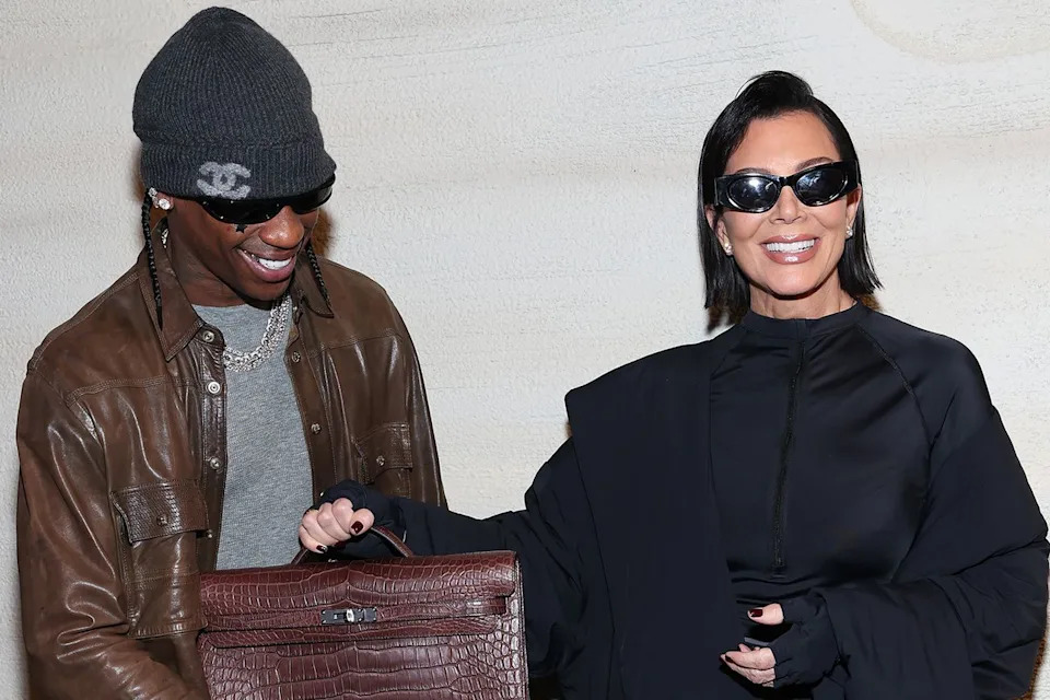 Kevin Mazur/Getty Travis Scott and Kris Jenner pose together in Sept. 2025.