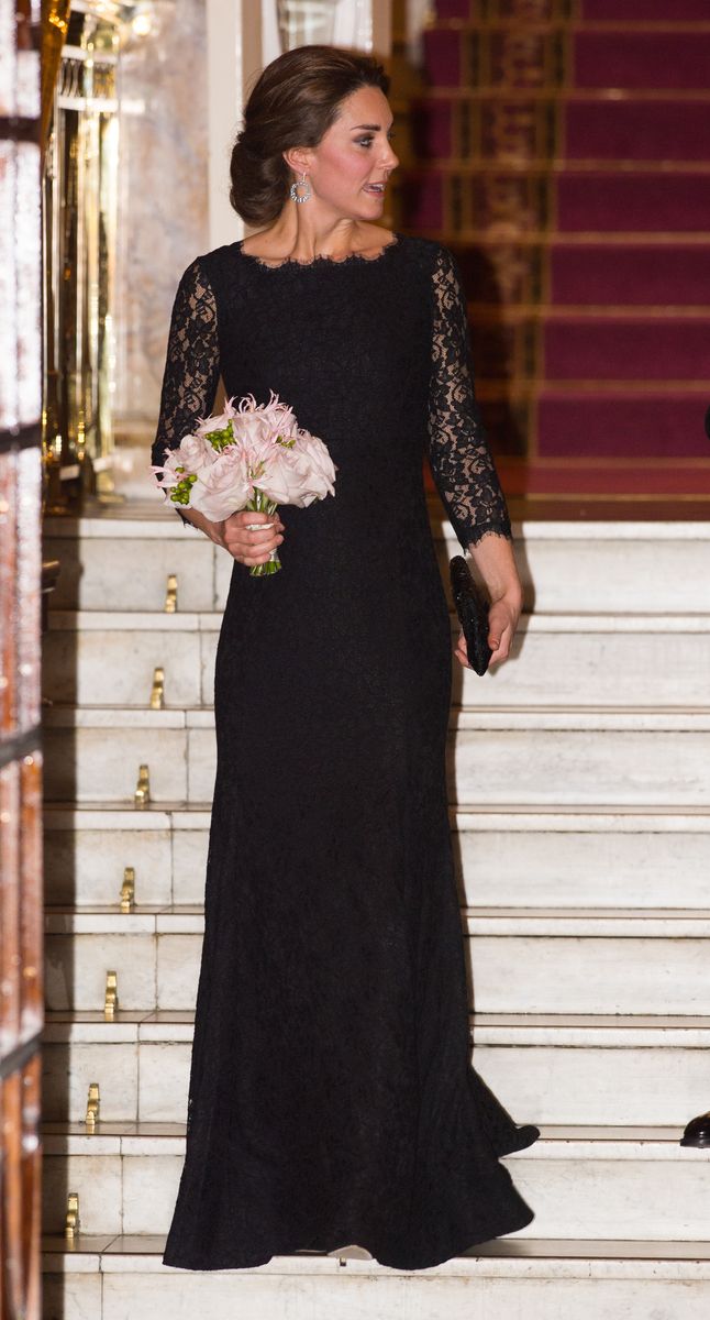 Kate wore a black lace gown with sheer sleeves and a scalloped round neckline in 2014
