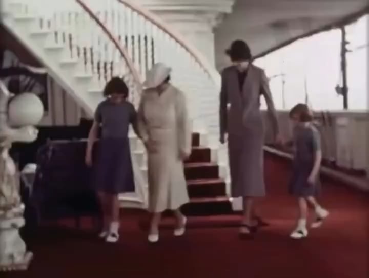 Young Queen Elizabeth II with her mother, Queen Elizabeth the Queen Mother, sister Princess Margaret and their nanny Crawfie dancing at sea in the 1930s