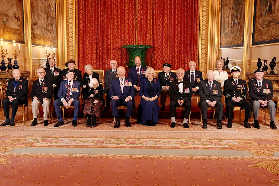 JONATHAN BRADY/POOL/AFP via Getty  Prince William, King Charles and Queen Camilla with veterans at Windsor Castle on Nov. 11, 2025
