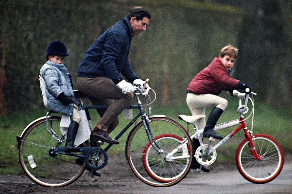 Julian Parker/UK Press via Getty King Charles, Prince William and Prince Harry on bikes at the Sandringham Estate.