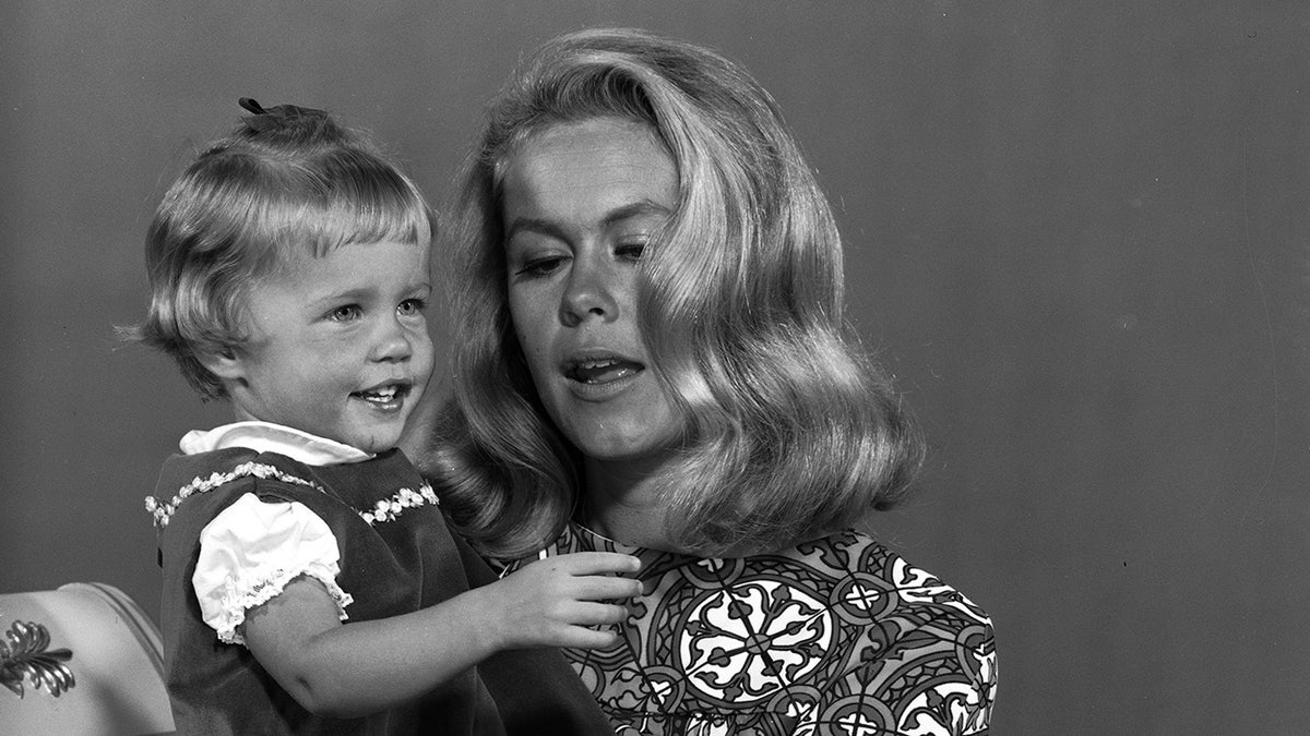 Erin Murphy being held as a child by Elizabeth Montgomery