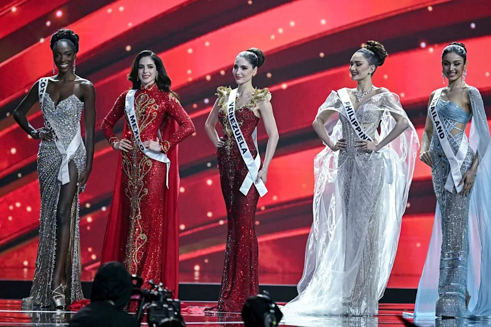 LILLIAN SUWANRUMPHA/AFP/Getty Olivia Yace and her fellow top five contestants at Miss Universe 2025.