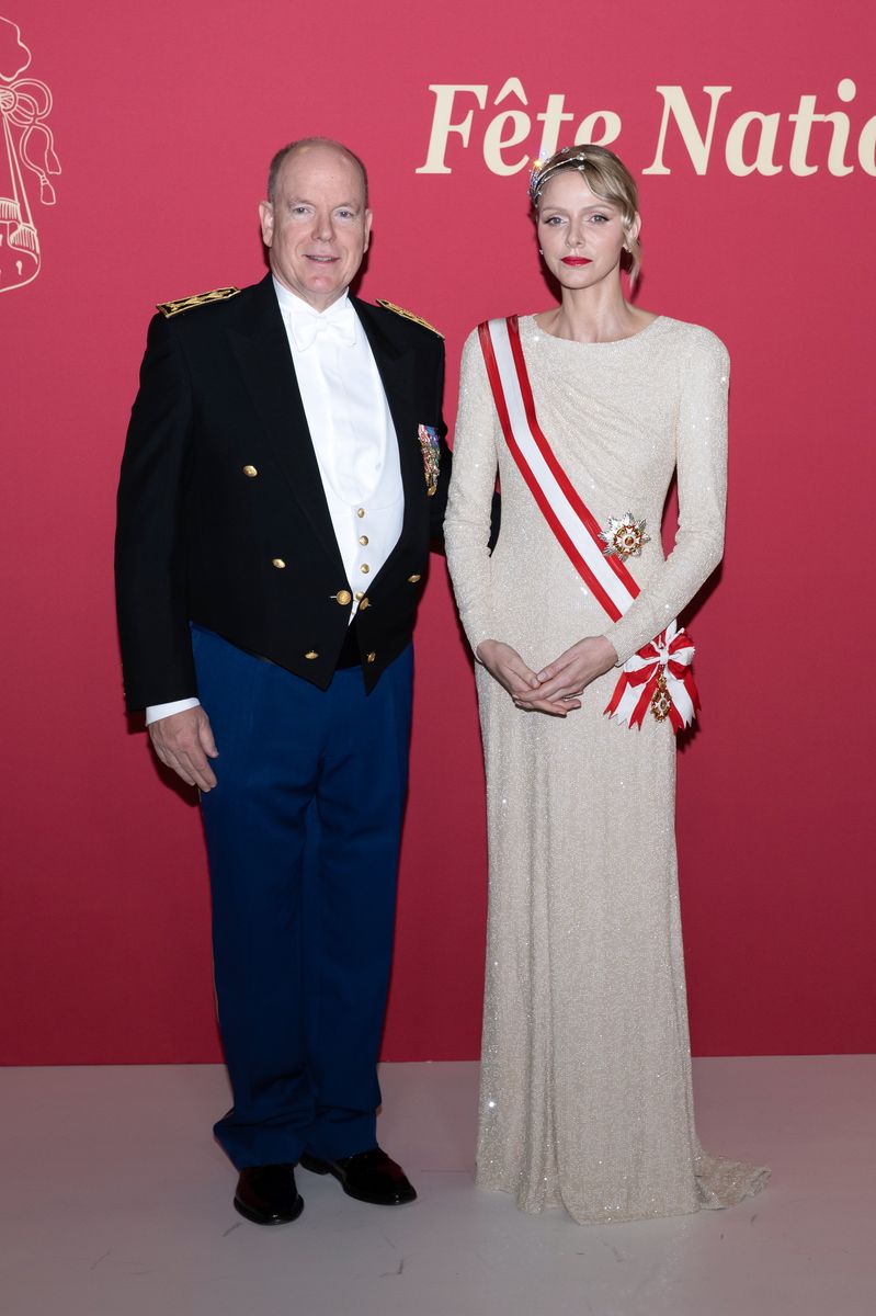The Princess paired her crown with a cream colored gown and a red and white sash