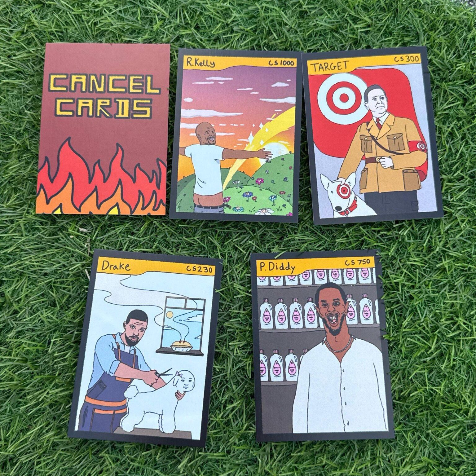 ‘Cancel Cards’ featuring R.Kelly, Diddy, and Drake are being sold at Childish Gambino’s GILGA Stand at Camp Flog Gnaw.