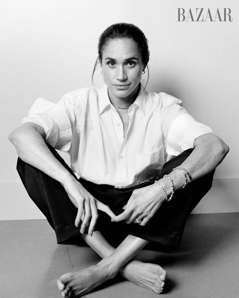 stylish individual seated in a relaxed pose showcasing modern fashion stylish individual seated in a relaxed pose showcasing modern fashion