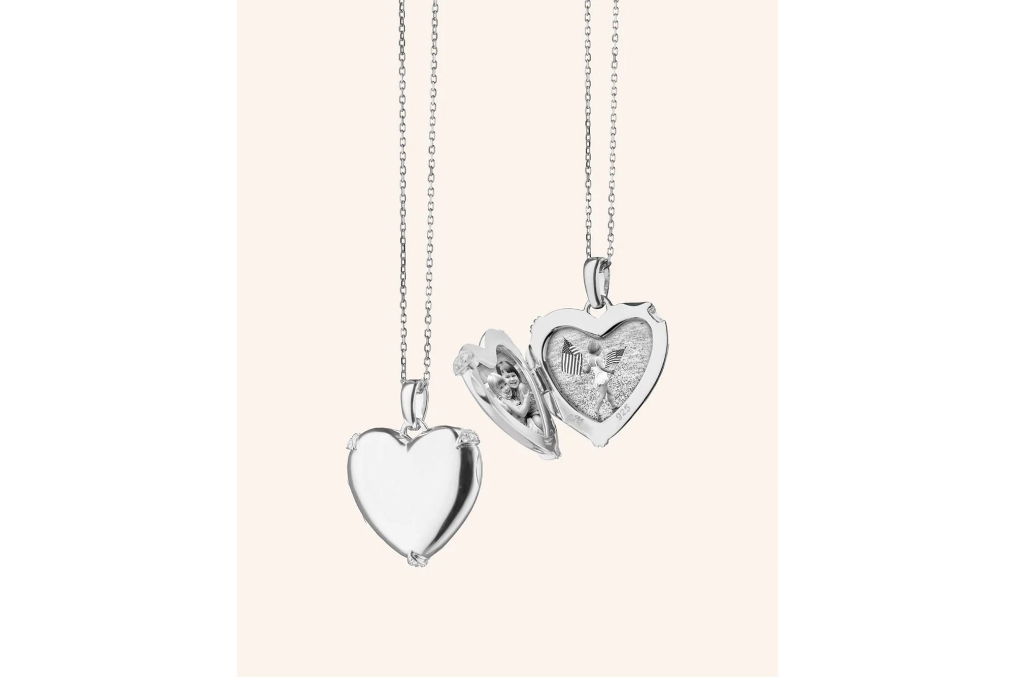 Two silver heart-shaped lockets, one closed and one open revealing two children and US flags.