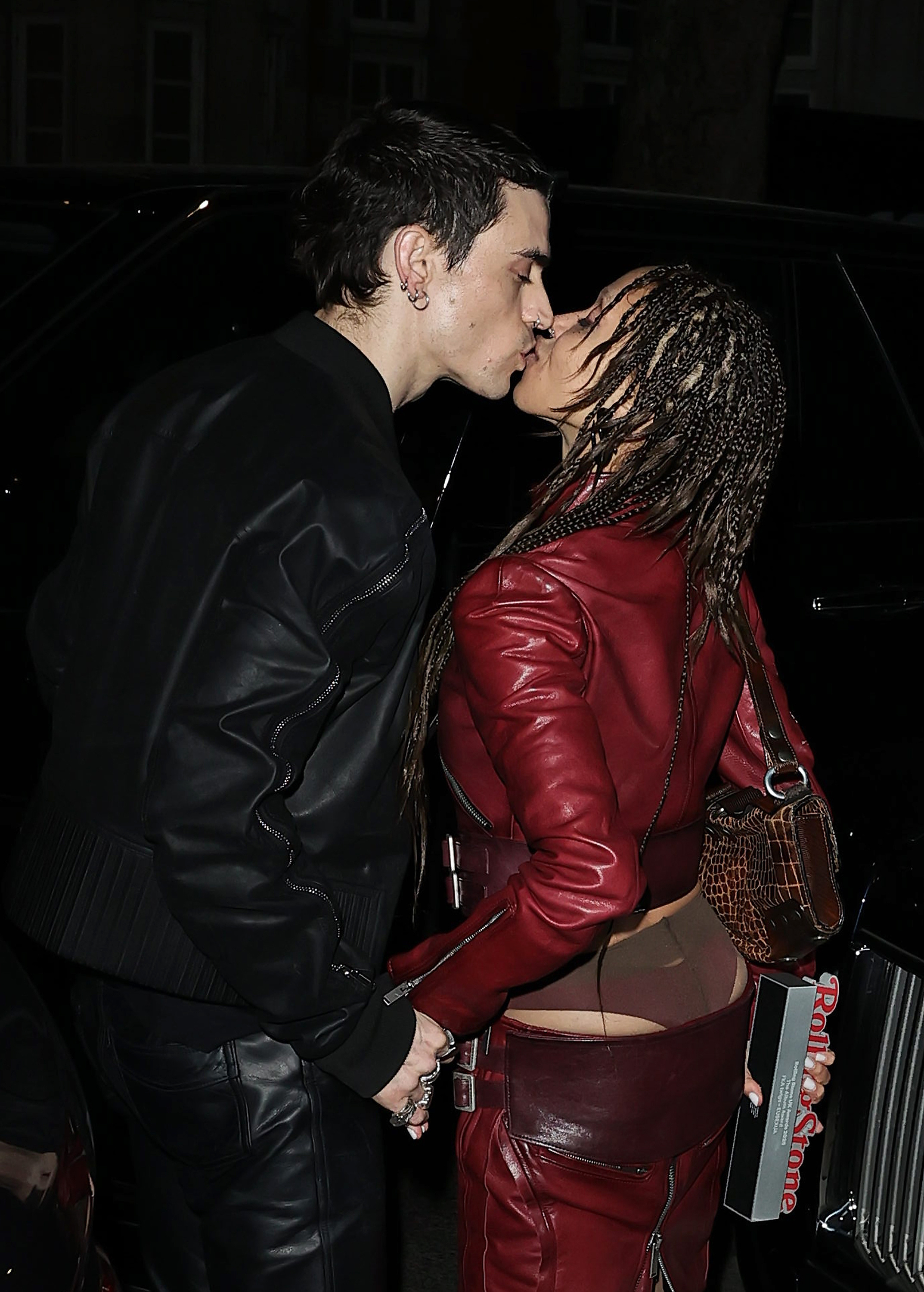FKA Twigs and Jordan Hemingway pucker up after a studded party held at 38 Mayfair in London. 