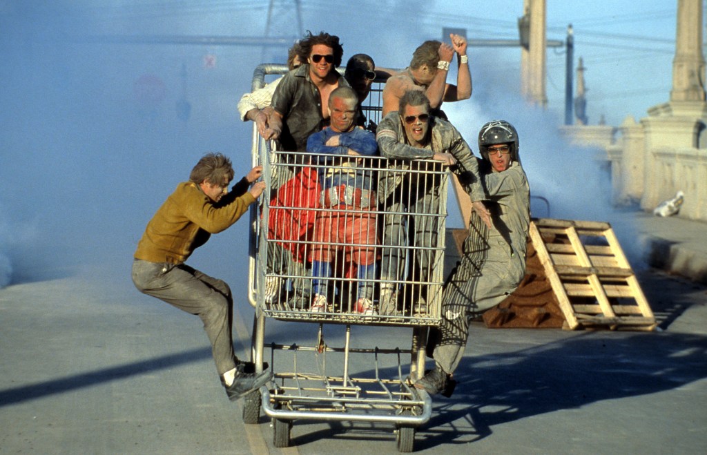 Knoxville and the other stars from "Jackass" ride a shopping cart in a scene from the film "Jackass: The Movie" in 2002.