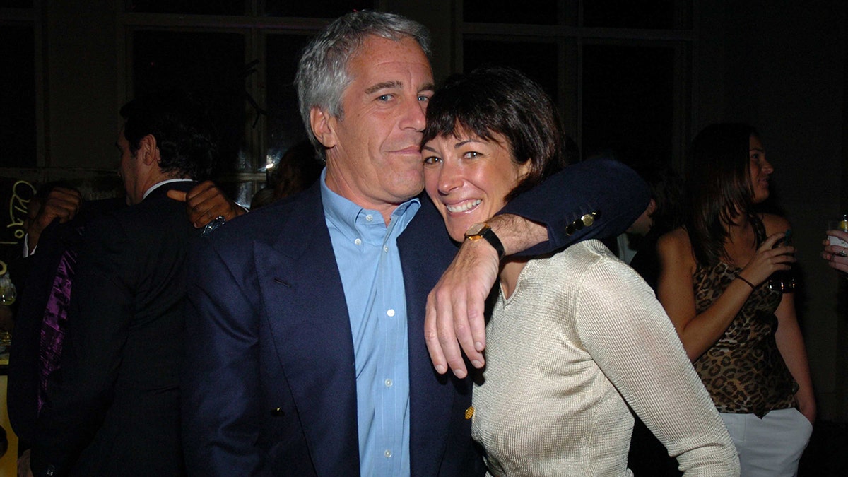 Jeffrey Epstein embracing a smiling Ghislaine Maxwell 