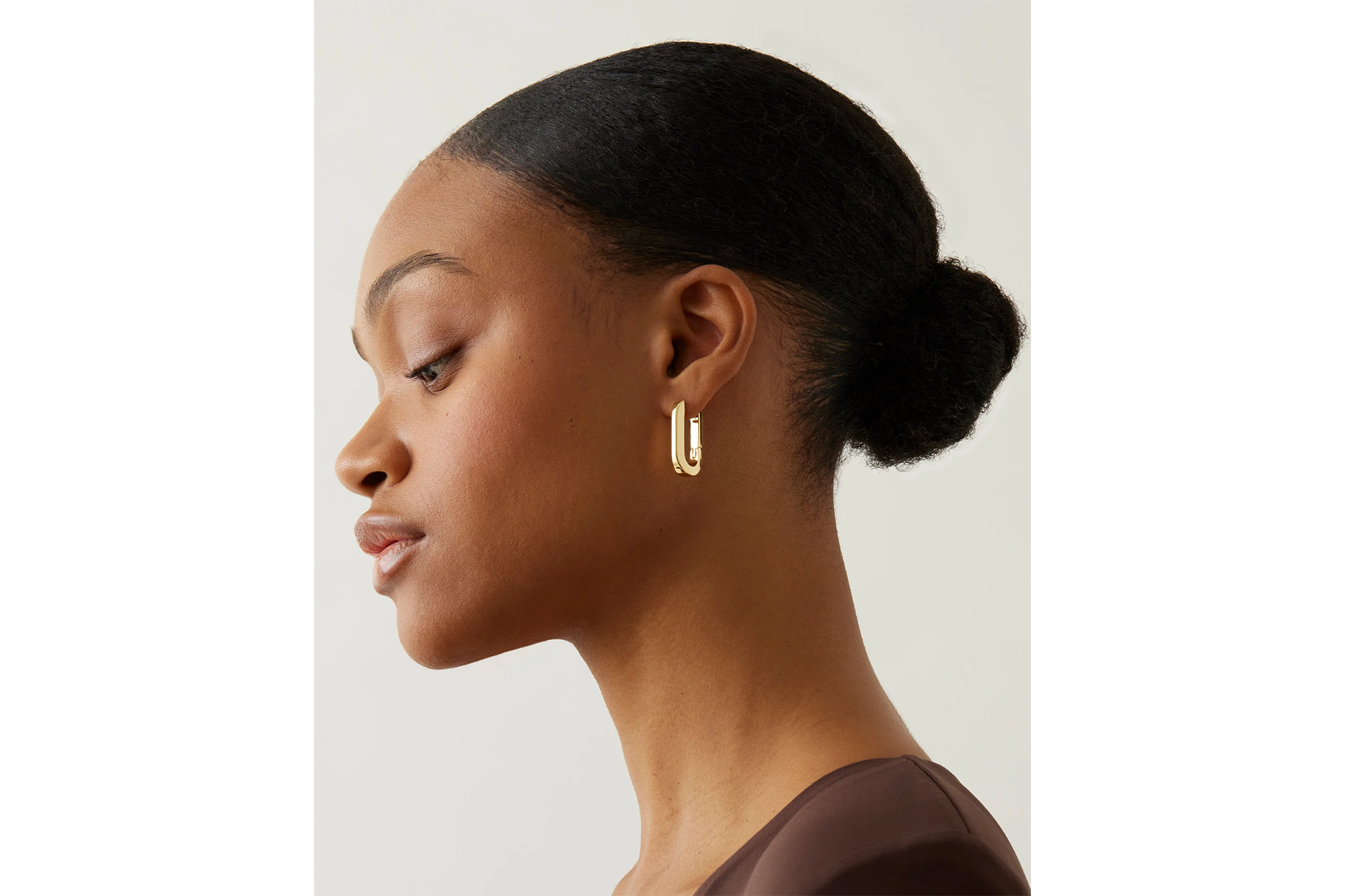 Jenny Bird U-Link earrings on a woman.