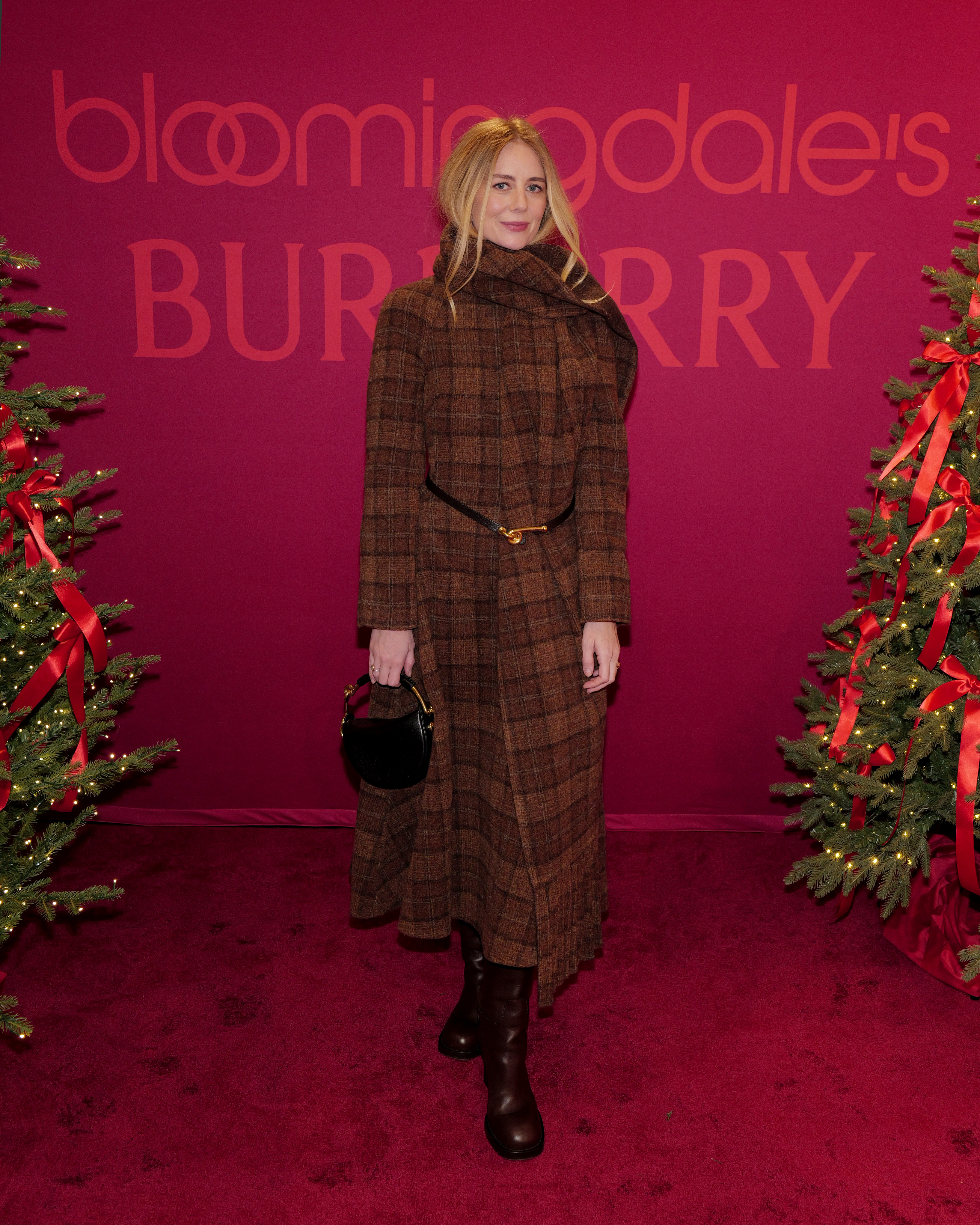 Justine Lupe attends as RAYE lights up New York at Bloomingdale's holiday window unveil with special partner Burberry at Bloomingdale's on November 19, 2025 in New York City.