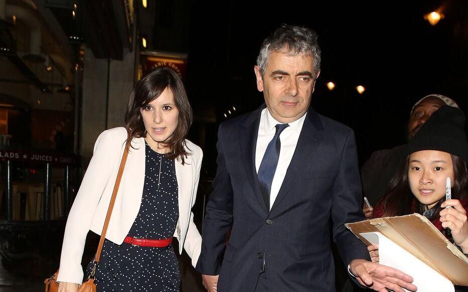 Rowan Atkinson, 61 with his girlfriend Louisa Ford, 32 stepping out in London in 2015. They're still together
