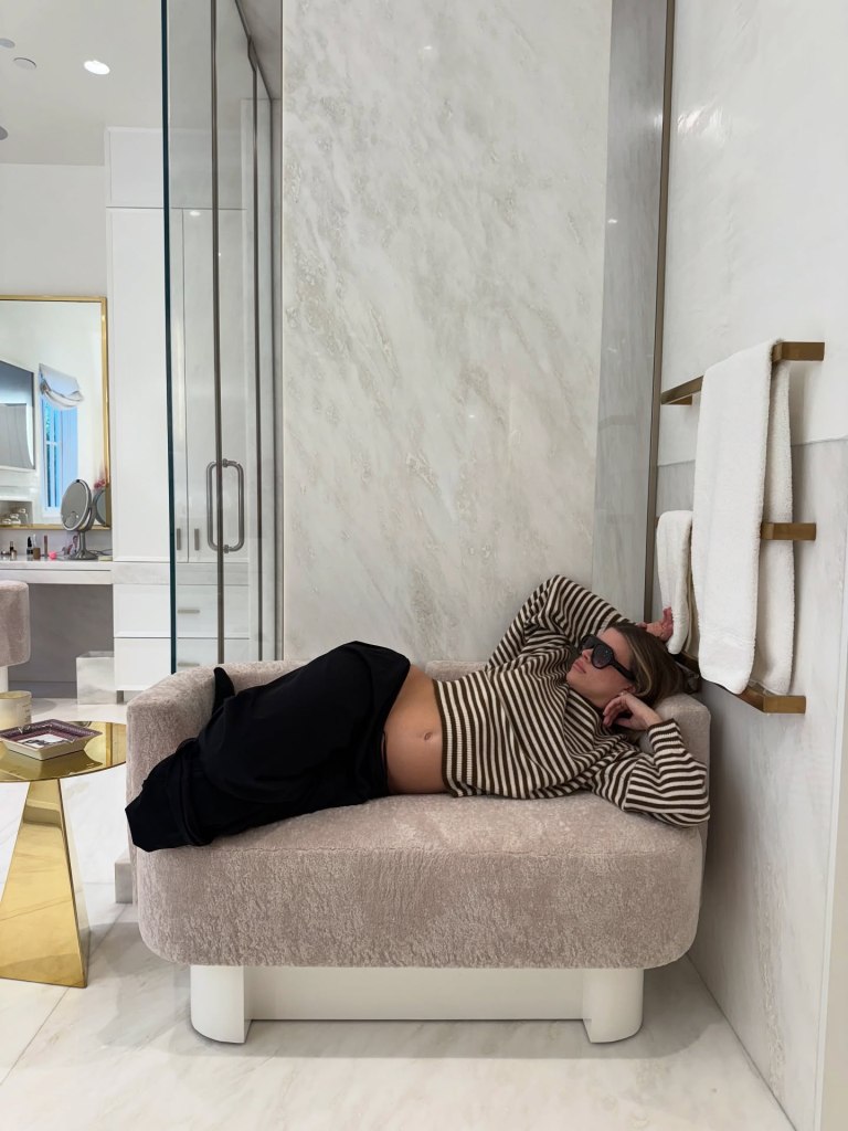 Sofia Grainge rests with her baby bump during "month five".