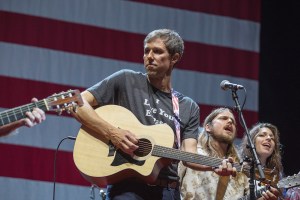 AUSTIN, TX - JULY 04: Beto O'Rourke (L) and Lukas Nelson perform onstage with Willie Nelson and Family during the 45th Annual Willie Nelson 4th of July Picnic at Austin360 Amphitheater on July 4, 2018 in Austin, Texas. (Photo by Rick Kern/WireImage)
