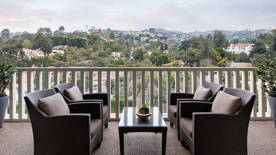 A terrace with two chairs.