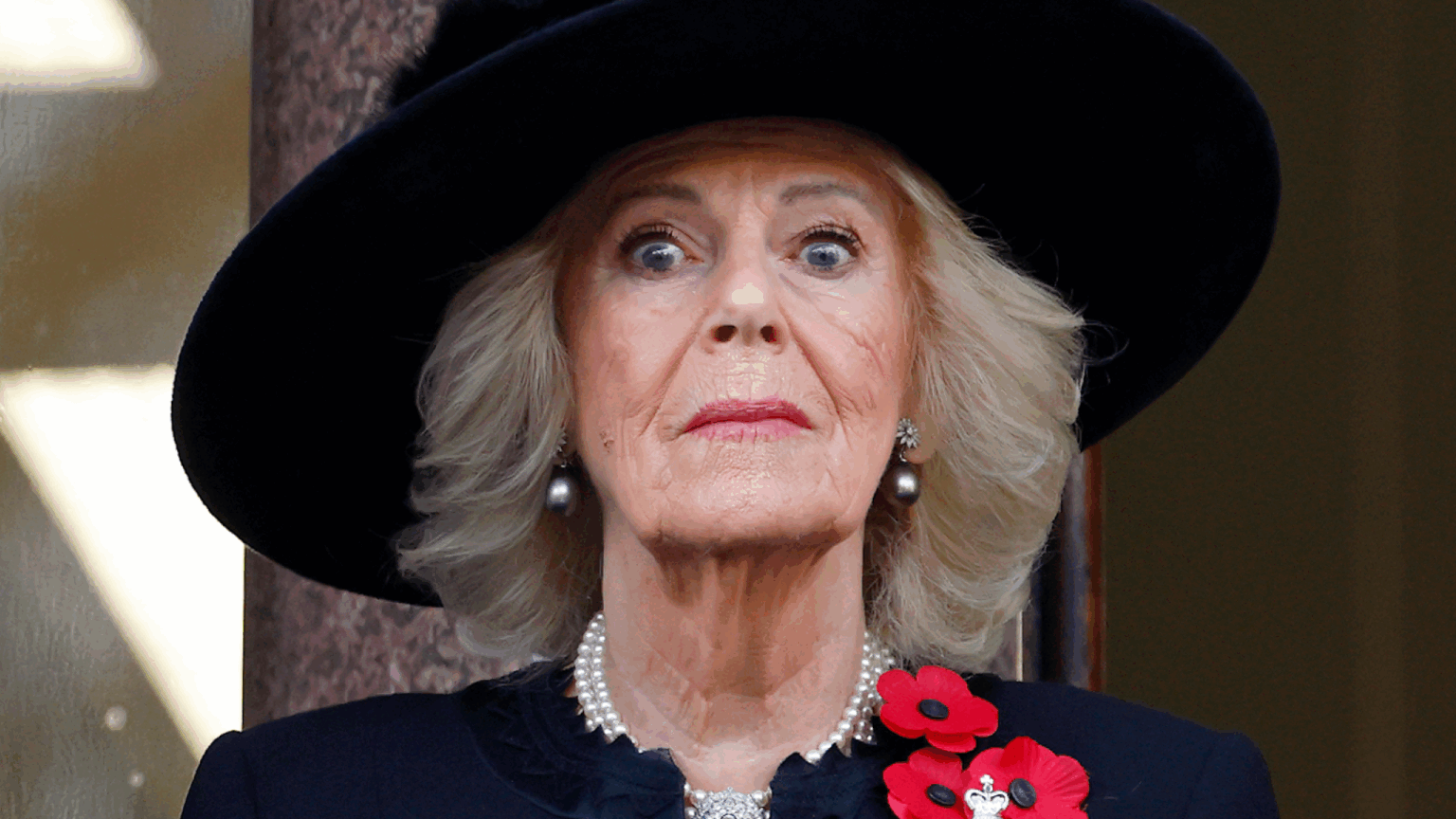 Thieves Once Ran Off With Queen Camilla’s Jewels and Buckingham Palace “Buried” the Incident “To Avoid Embarrassment” Queen Camilla wearing a big black hat looking surprised