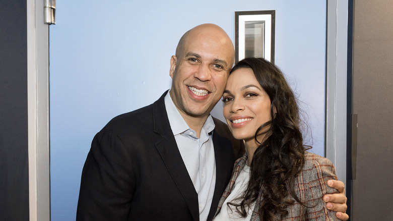 Cory Booker puts his arm around Rosario Dawson