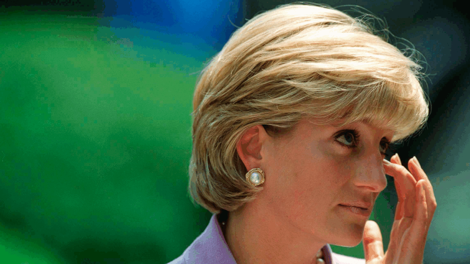 Former Royal Chef Says Princess Diana Spent Her Last Christmas “Alone” After “Frosty Reception” From Royal Family Princess Diana wearing a purple suit and rubbing her eye
