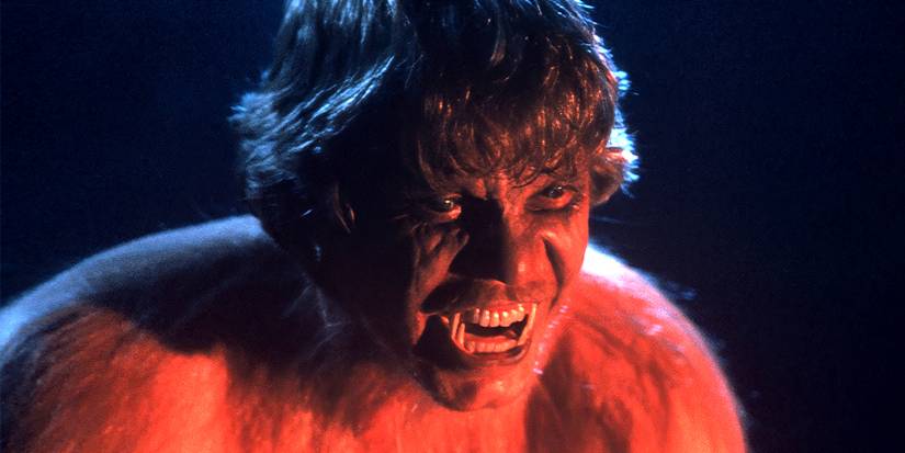 Christopher Stone with teeth bared mid-transition into a werewolf in The Howling