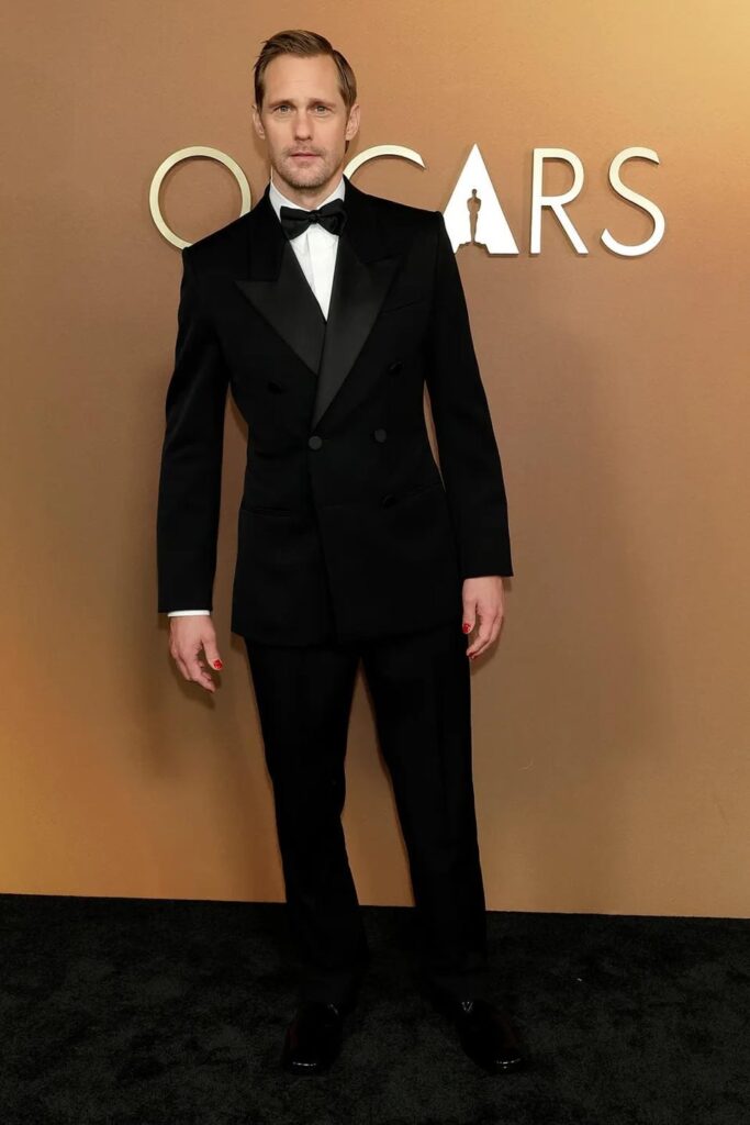 Alexander Skarsgård rocking red nails at the Governors Awards
