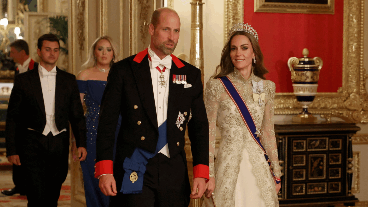 Prince William in a uniform and Princess Kate wearing a gold gown at US state visit