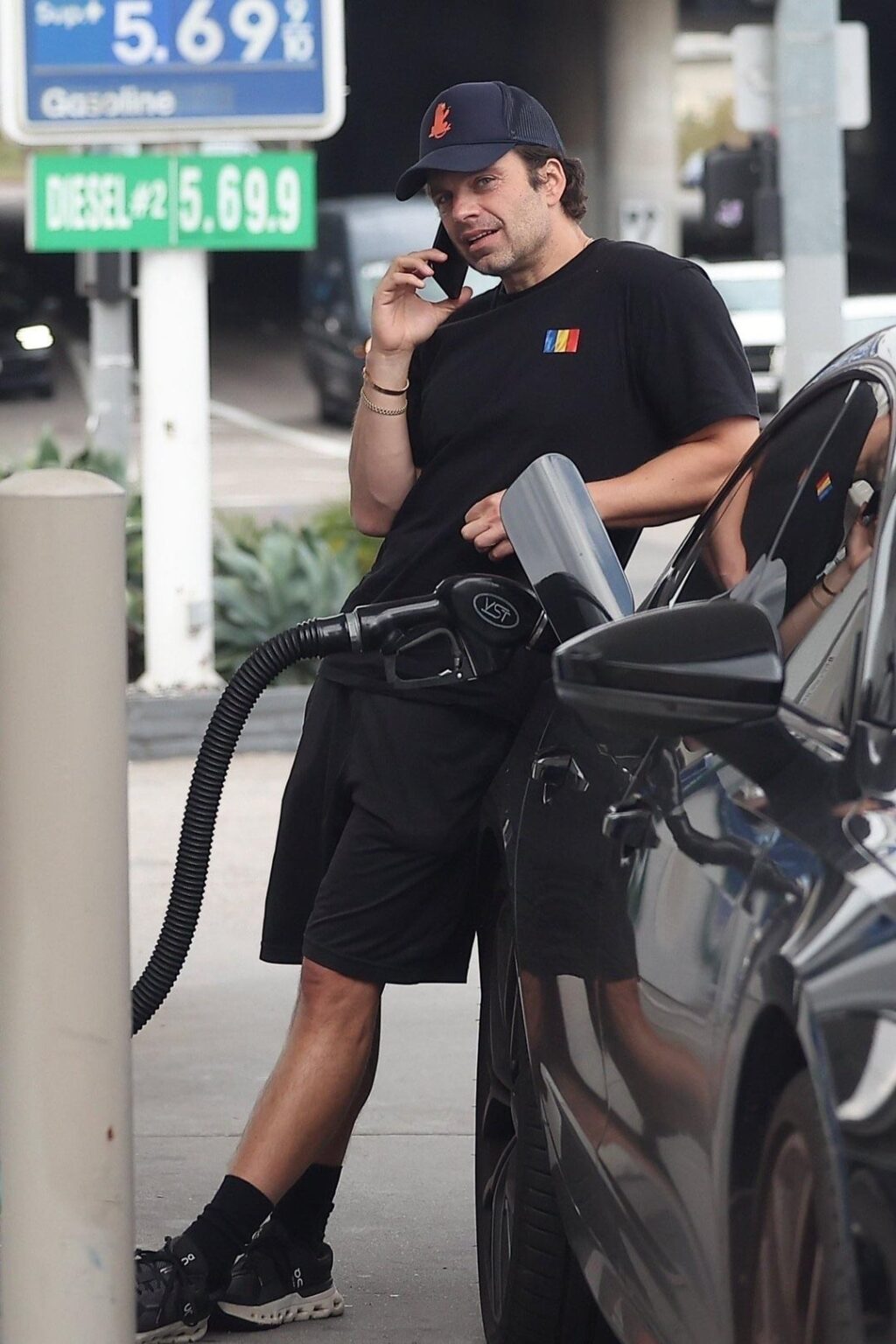 Sebastian Stan (wearing a shirt with a Romanian flag on it - he was born there) in Los Angeles (November 20, 2025)