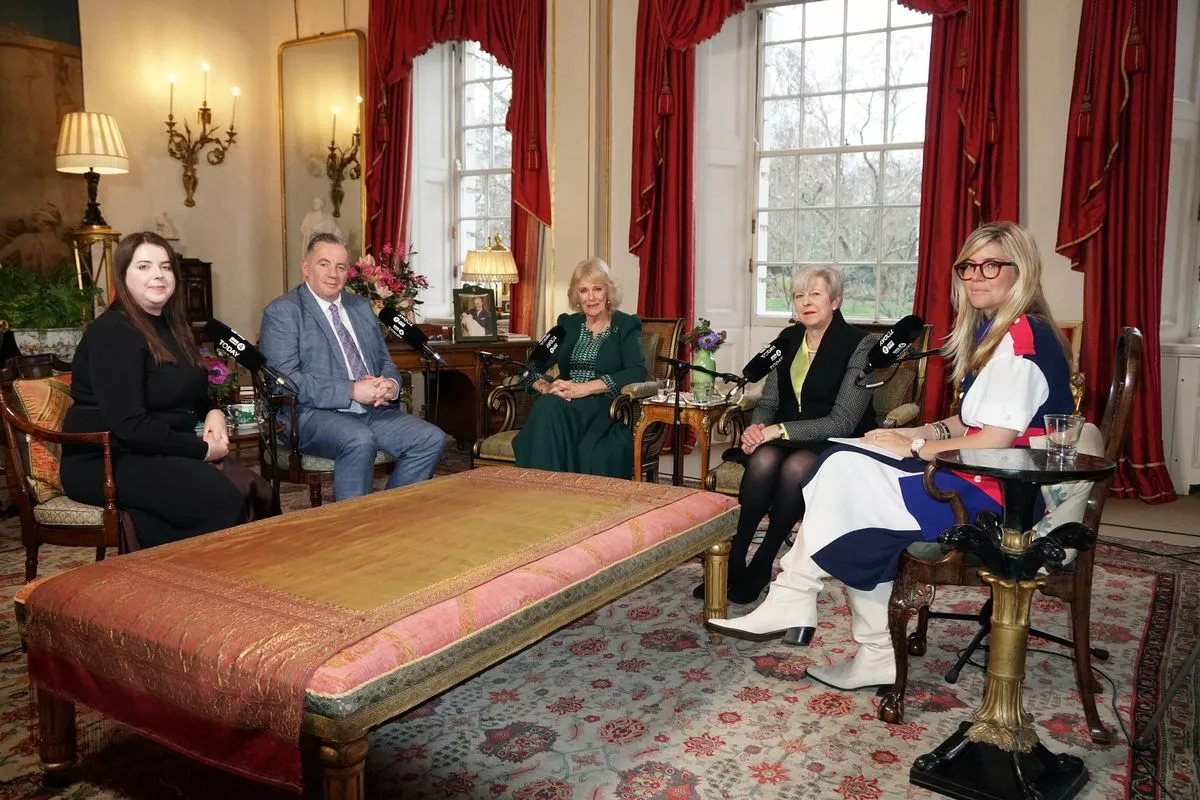 Queen Camilla with (left to right) Amy Hunt, John Hunt, former prime minister Baroness May and Emma Barnett in the Garden Room of Clarence House, London