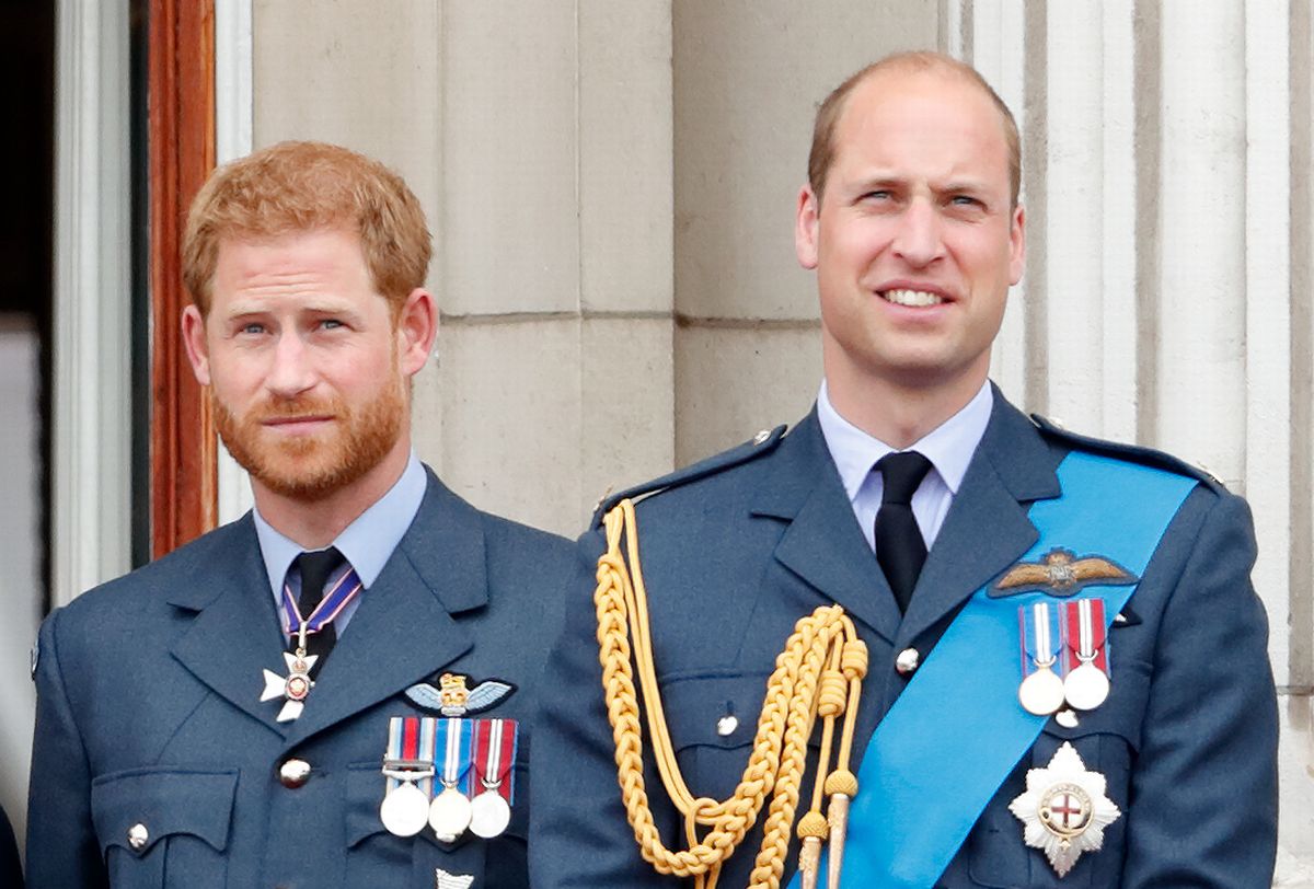 Prince Harry, Duke of Sussex and Prince William, Duke of Cambridge watch a flypast to mark the centenary of the Royal Air Force from the balcony of Buckingham Palace on July 10, 2018 in London, England. 