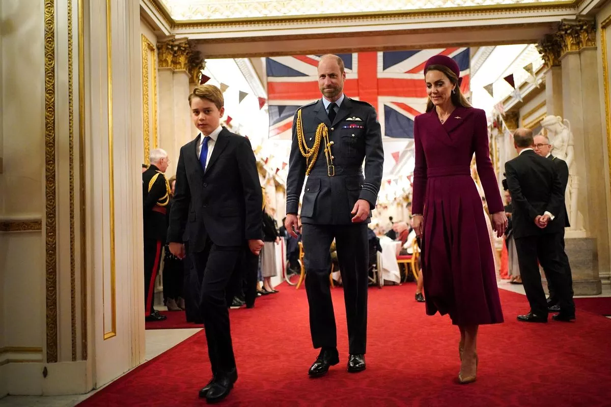 George on an engagement with his parents to mark VE Day