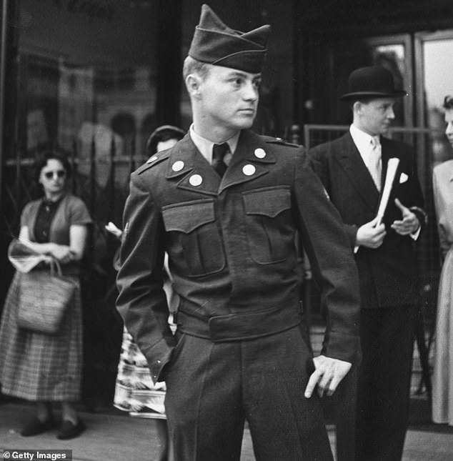 An American soldier waiting outside Swan & Edgar department store in Piccadilly Circus, 1952