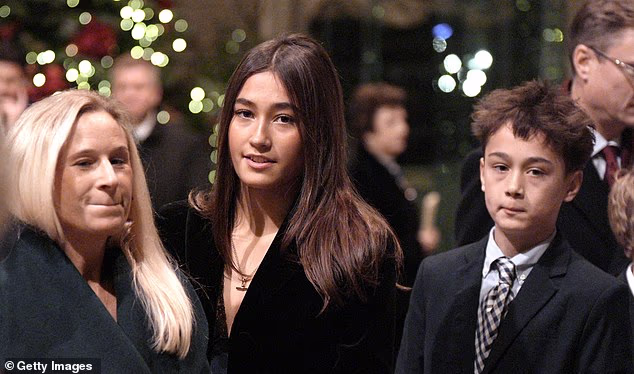 Lady Davina Windsor's daughter Senna K¿whai Lewis (centre) and son Tane Mahuta, 13, at the Princess of Wales' Together at Christmas service at Westminster Abbey on December 5 in London