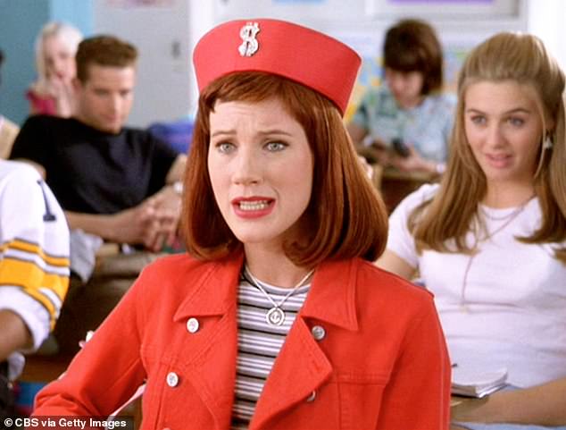 Seen in a red outfit with Silverstone behind her