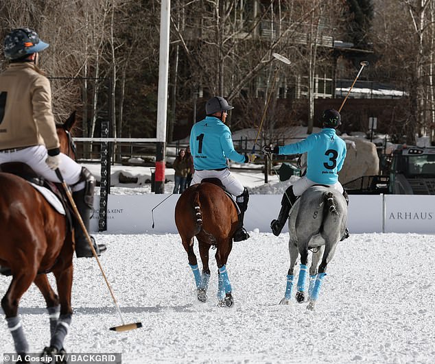 The Duke of Sussex is seen chatting with his teammate during the match in Aspen yesterday
