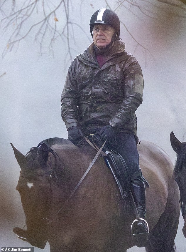 Andrew Mountbatten-Windsor rides in the rain in Windsor Park earlier this week, having not been invited the King's annual pre-Christmas bash for the extended family