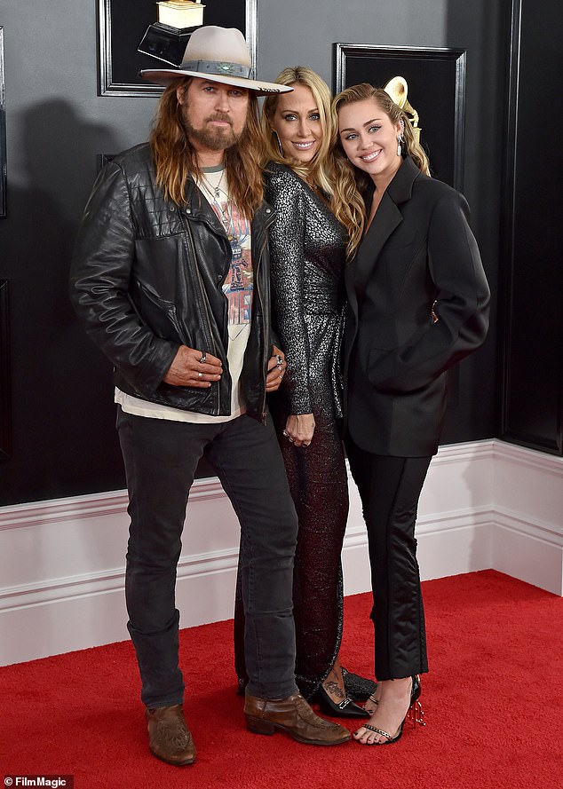 Cyrus - pictured with ex-wife Tish Cyrus and daughter Miley Cyrus in 2019 - got together with Hurley after his brief marriage to Firerose crashed and burned
