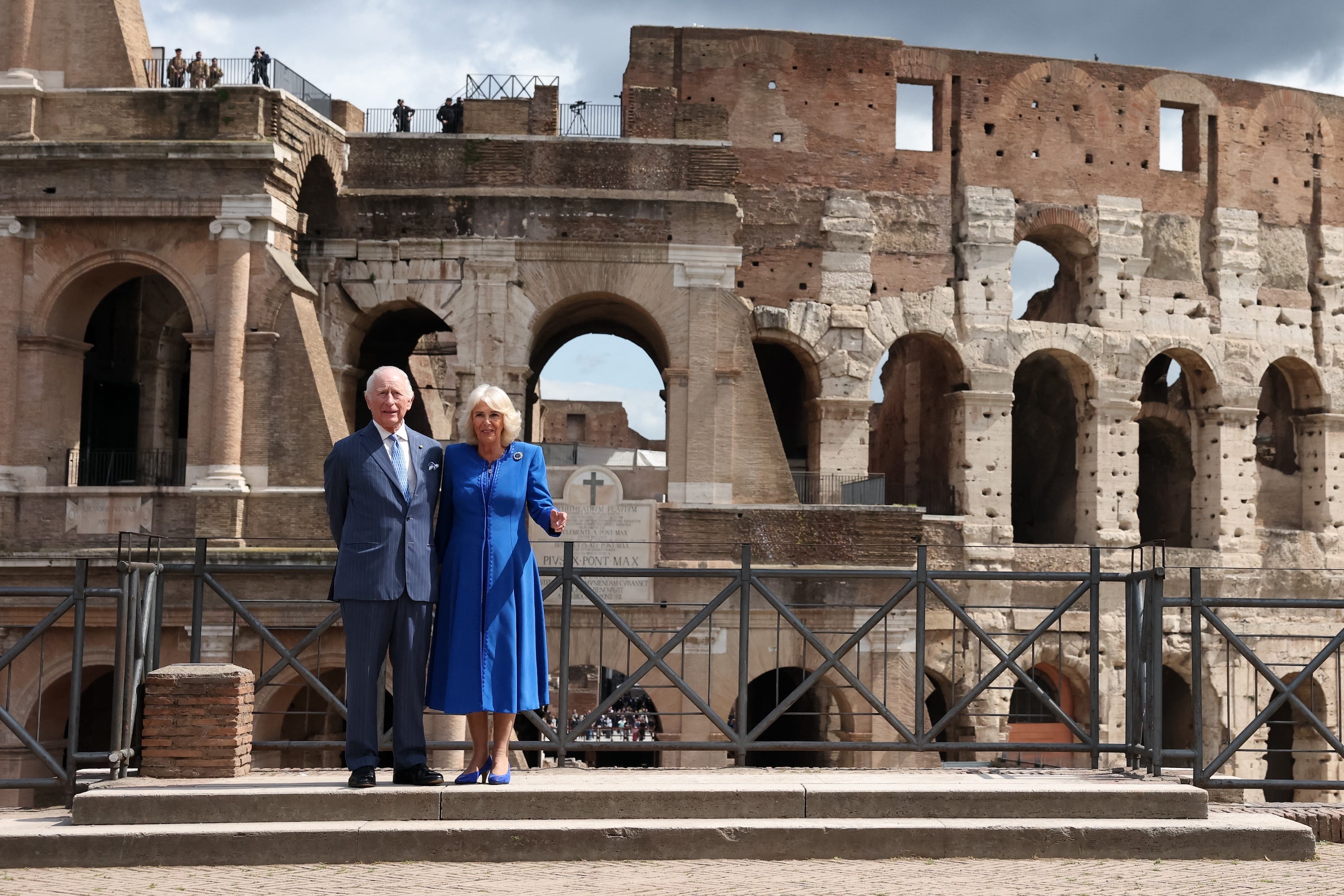 britain's king charles iii and queen camilla pose in front of the colosseum in rome as part of a four days state visit in italy, on april 8, 2025 photo by phil noble  pool  afp