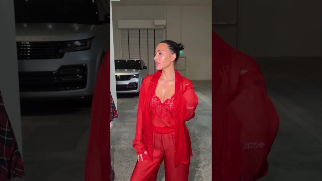 Kim Kardashian wears the SKIMS Romance Button Up Shirt and Pant Set.