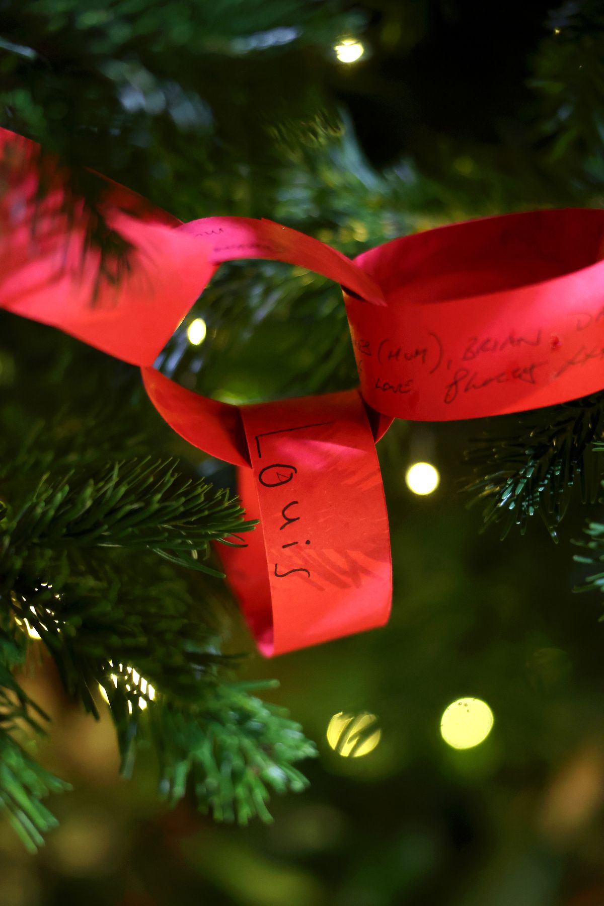 Prince Louis's handwritten name on a paper chain on a Christmas tree at the 'Together At Christmas' Carol Service at Westminster Abbey on December 05, 2025