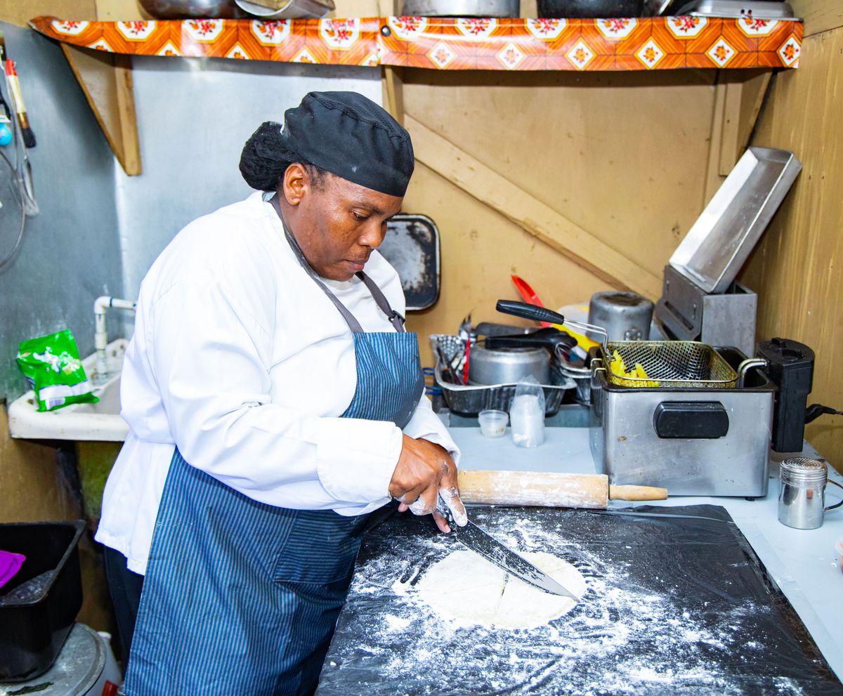 Tanisha whips up potato scones in Jamaica for her customers 